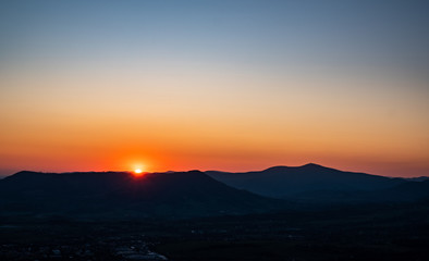 beautiful forest with green grass at sunrise, Czech Republic