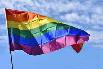 Lgtb rainbow flag waving on a blue sky. LGTB movement