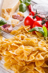 concept of traditional italian pasta with tomatoes and basil