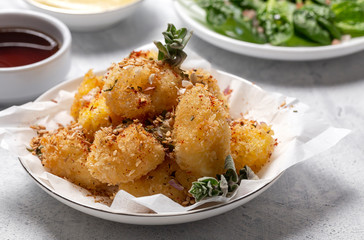 Fried small cheese mozzarella balls breaded in panko