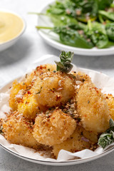Fried small cheese mozzarella balls breaded in panko