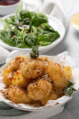 Fried small cheese mozzarella balls breaded in panko