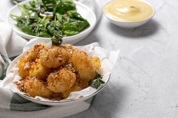 Fried small cheese mozzarella balls breaded in panko