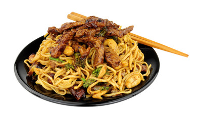 Beef in black bean sauce with egg noodles and cashew nuts meal isolated on a white background