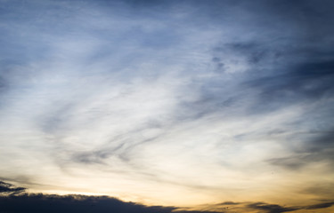 Fototapeta na wymiar Sunset in the clouds in the form of tracks Sunset light Clouds in the form of long orange stripes in the sky
