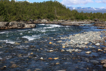 Kungsleden river in the arctic tundra. Abisko national park, Nothern Sweden