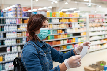 View of beautiful woman with medical mask shopping