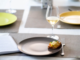 remote work from home. home office. sandwich on a plate. glass of wine