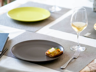 remote work from home. home office. sandwich on a plate. glass of wine