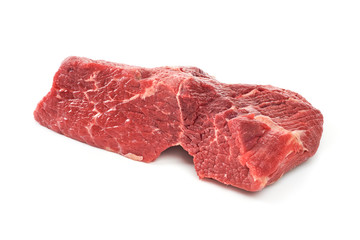A large piece of peeled side of veal meat on a white background. A fresh piece of knuckle.