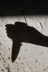 Shadow of the hand holding a knife