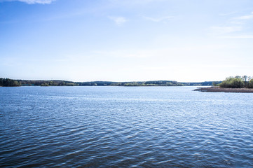 Beautiful blue lake in summer sunny day