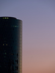 A fragment of the modern business building in sunset light.