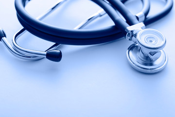 Close up on a stethoscope on a blue background