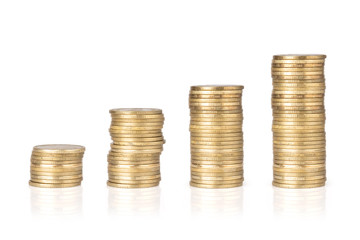 Gold coins stacked on a white background. Money saving concept