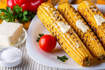 grilled corn cob on white wooden rustic background