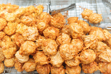 Delicious of traditional asian cuisine. Hot fried snacks at street market