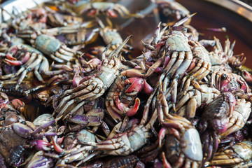 Heap of fresh cooked salted crabs at asian seafood market