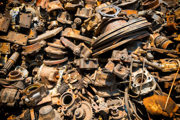 Pile of old rusty metal scrap, used machine spares and car parts can be used as mechanic industrial background