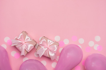 Obraz na płótnie Canvas Two gift boxes with pink ribbon bow on pastel pink background with white confetti and balloons. Banner for Valentines day, Birthday or Mothers Day. Best gift for women. Top view, flat lay free space.
