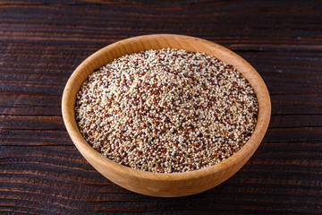 mix of quinoa grains on dark wooden rustic background