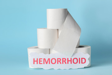 Toilet paper on color background. Hemorrhoids concept