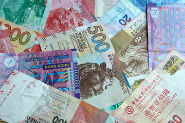 A colorful assortment of Hong Kong Dollar banknotes showcases the region's economic strength and...