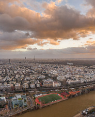 Aerial drone shot of Neuilly in Paris with Eiffel tower and boulogne forests during sunset hour