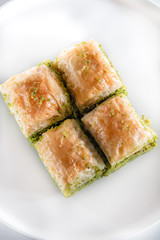 Traditional, delicious Turkish baklava on white plate