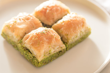 Traditional, delicious Turkish baklava on white plate