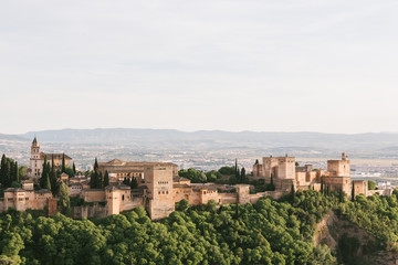 Fototapeta na wymiar Granada, Spain. Beautiful aerial view of the Alhambra palaces with the Sierra Nevada mountains in the background.