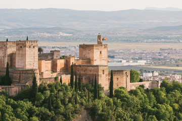 The Alhambra of Granada in Spain on a spring afternoon with the sunset.