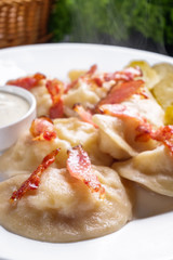 traditional Ukrainian dish of dumplings with sour cream