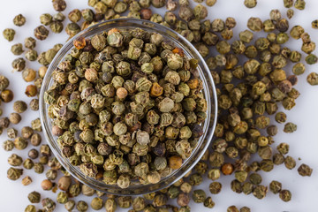 green peppers in glass bowl on white background