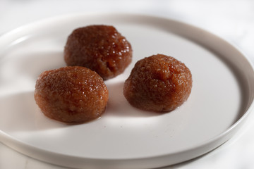 Turkish Dessert Kemalpasa with Hazelnut Powder and Sherbet / Serbet.
