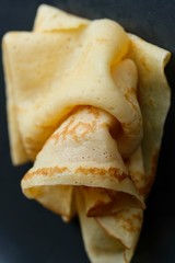Cheesy, beautiful, delicate pancake closeup. Soft focus and gentle bokeh.