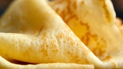 Cheesy, beautiful, delicate pancake closeup. Soft focus and gentle bokeh.