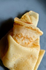 Cheesy, beautiful, delicate pancake closeup. Soft focus and gentle bokeh.