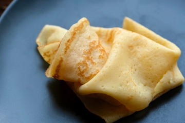 Cheesy, beautiful, delicate pancake closeup. Soft focus and gentle bokeh.