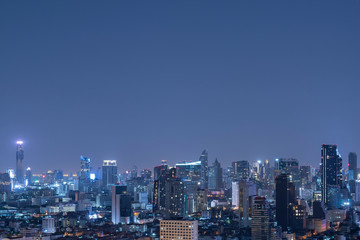Fototapeta na wymiar Bangkok city scape at night in blue tone with top copy space for your decide.