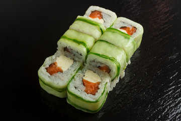 Japanese food: Set of salmon sushi and rolls with salmon and eel