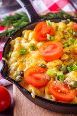 delicious pasta and cheese casserole in a cast iron skillet