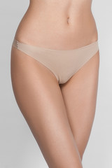 a woman in beige body shorts