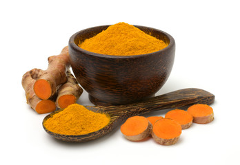 Turmeric (curcumin) powder and rhizomes isolated on a white background,Used for cooking .