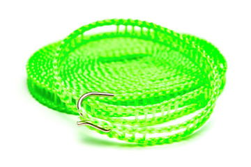 top view green plastic clothesline on white