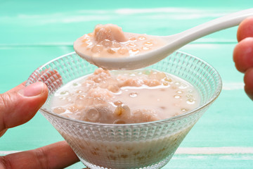 man eating Chinese syrup of sweet potato and sago