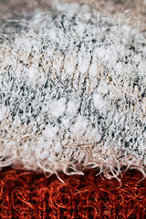 Close up sur des mailles en laine chaude, arrière plan matière douce