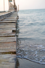 Wooden structure on a background of the sea. Pier going to sea - background.