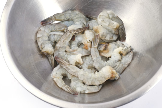 Fresh peeled uncooked shrimp harvest isolate white background
