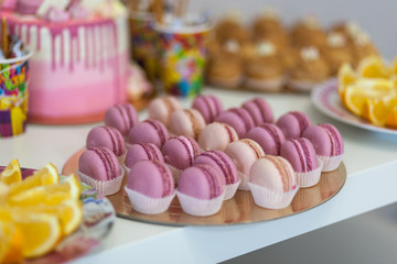 Set of different french cookies macaroons macaroons in a paper box.